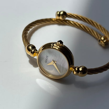 Gucci 1990s Seashell Round Dial Gold-Plated Cable Bangle Watch
