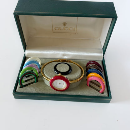 Gucci 1990s Interchangeable Bezel Gold Plated Bangle Watch with 12 bezels, case