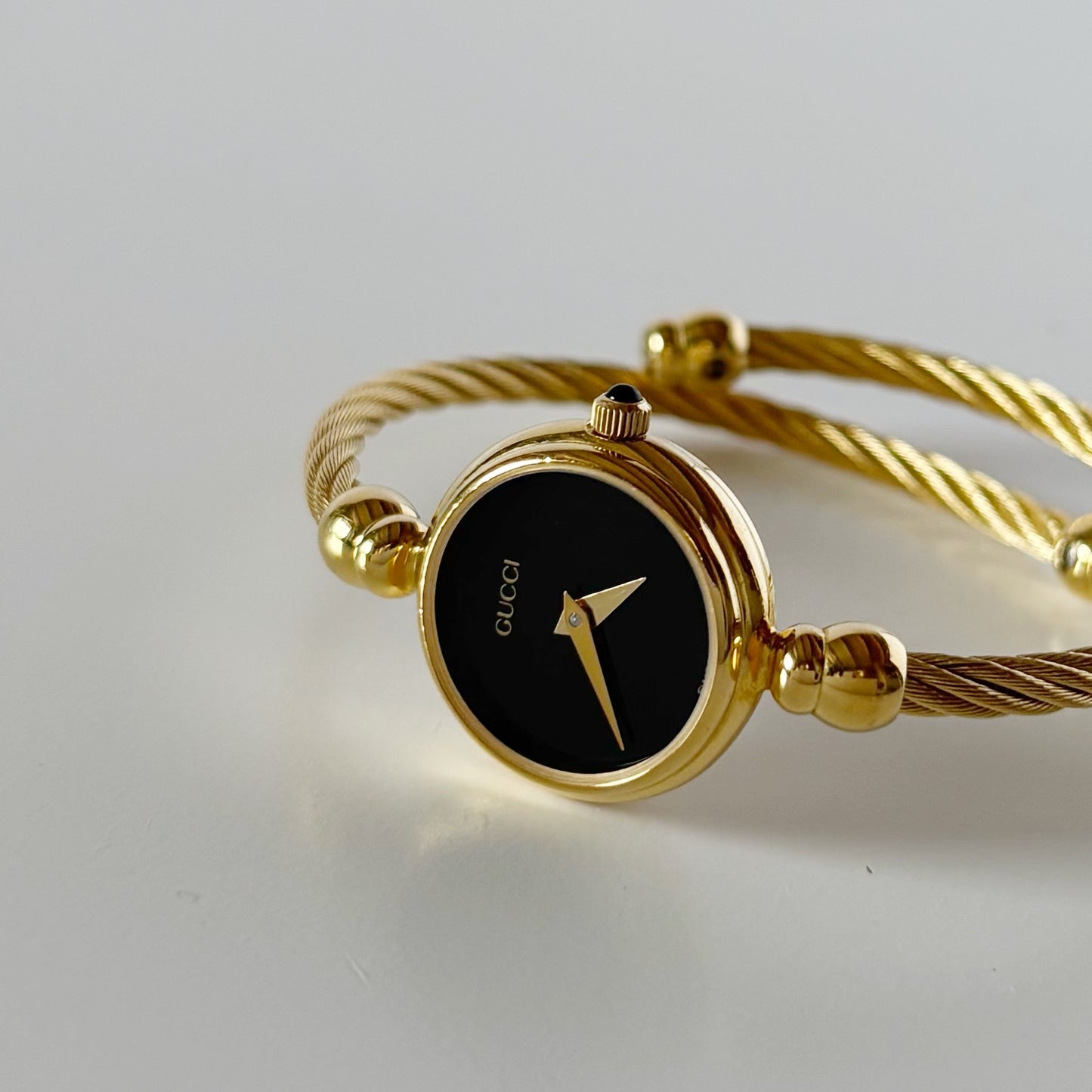 Gucci 1990s Black Dial Gold Plated Cable Bangle Watch