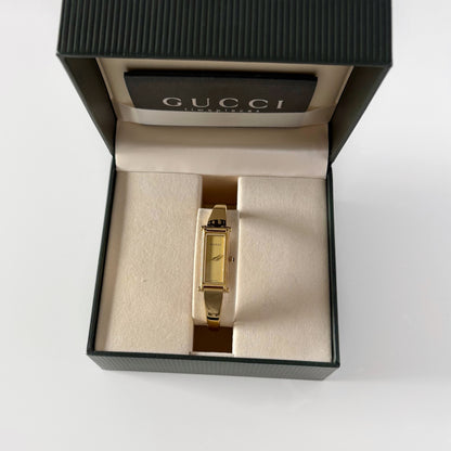 Gucci 1990s Rectangular Gold Dial Gold Plated Bangle Watch