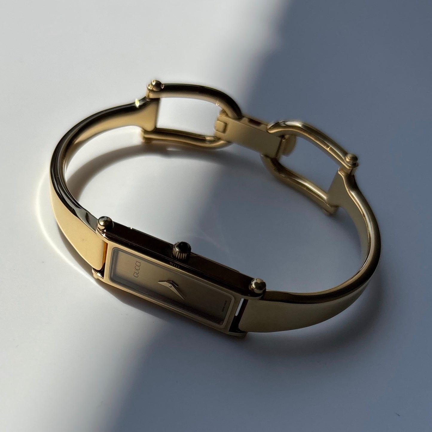 Gucci 1990s Gold Rectangular Dial Gold Plated Bangle Watch