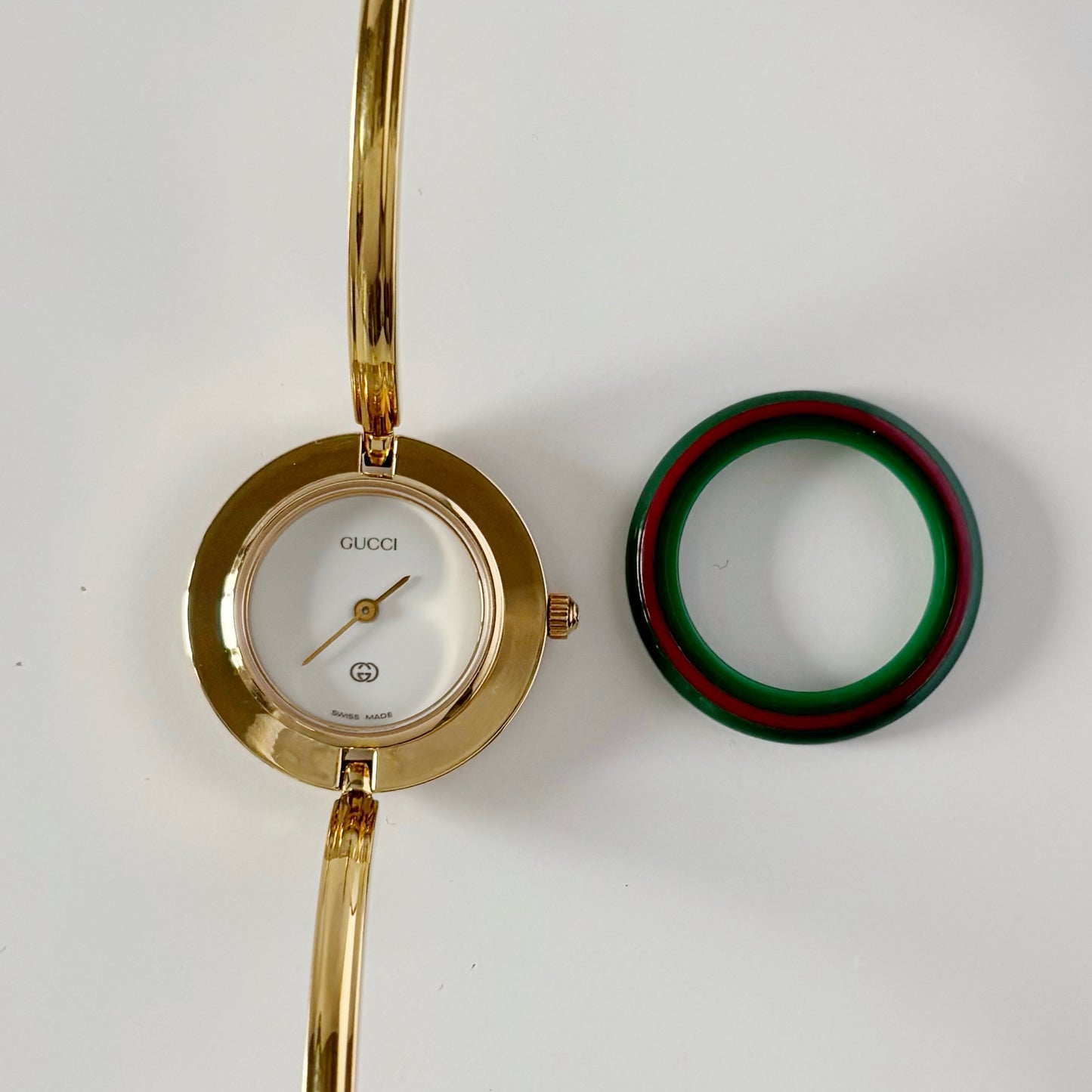 Gucci 1990s Interchangeable Bezel Gold Plated Bangle Watch with 12 bezels, case