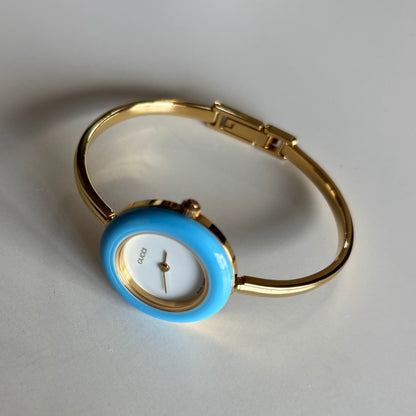 Gucci 1990s Interchangeable Bezel Gold Plated Bangle Watch with 12 bezels, case