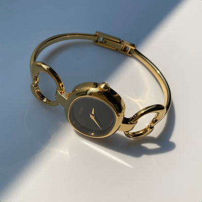 Gucci 1990s Black Dial Gold Plated Bangle Watch