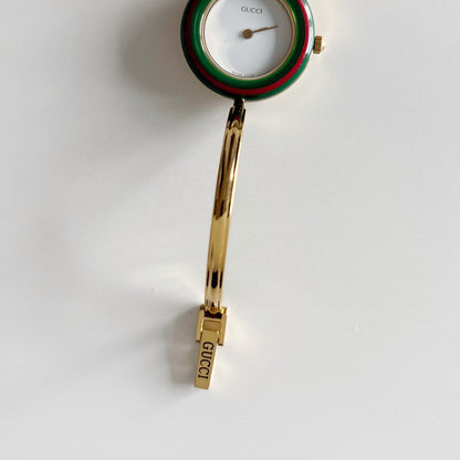 Gucci 1990s Interchangeable Bezel Gold Plated Bangle Watch with 12 bezels, case (Small)