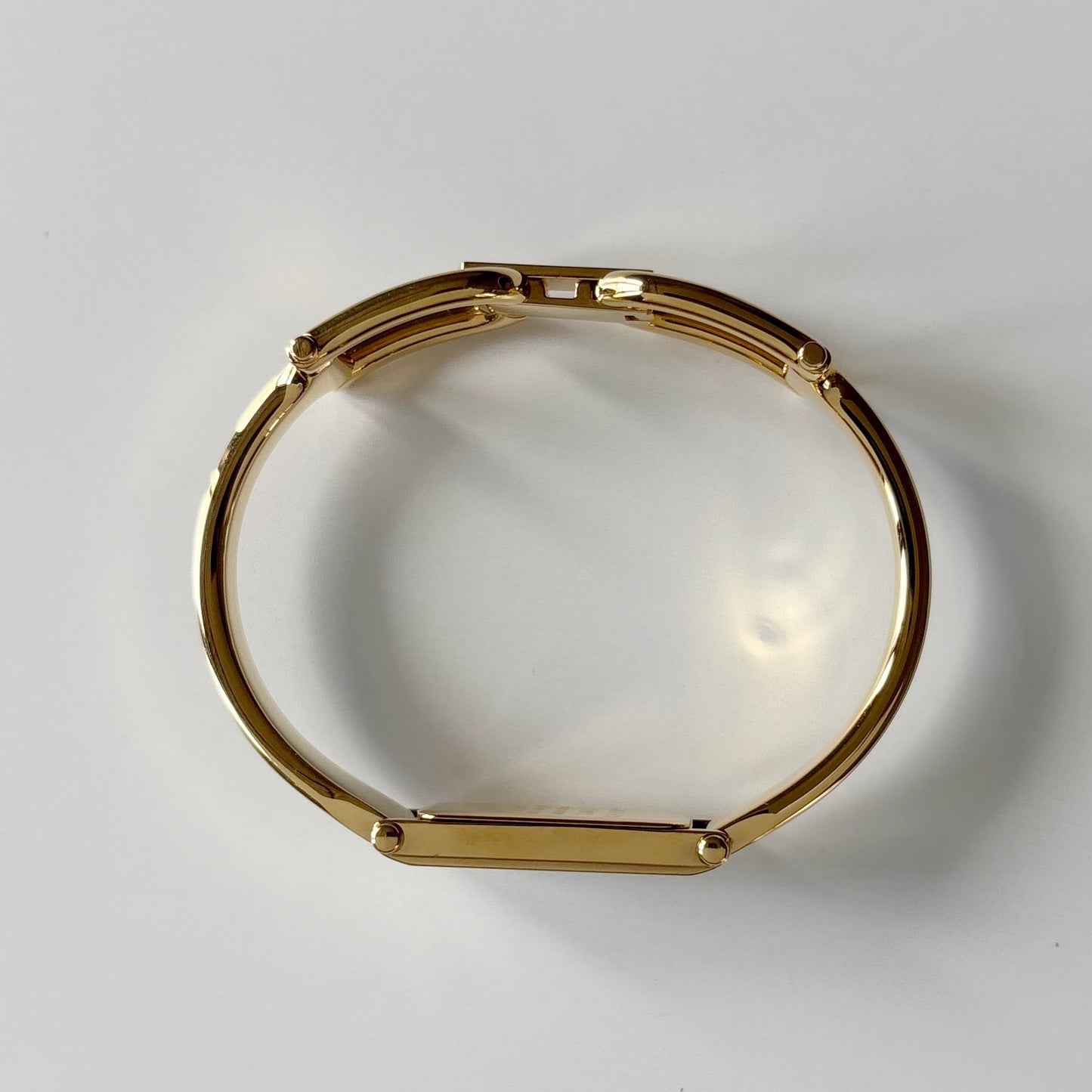 Gucci 1990s Black Rectangular Dial Gold Plated Bangle Watch