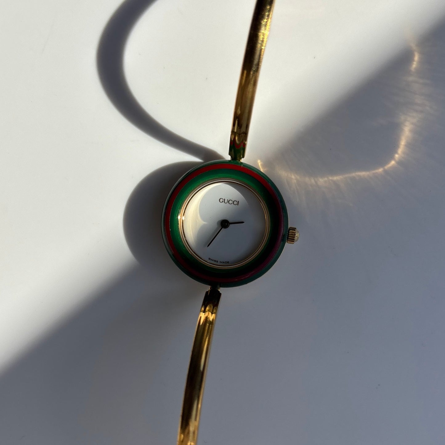 Gucci 1990s Interchangeable Bezel Gold Plated Bangle Watch with 12 bezels, case