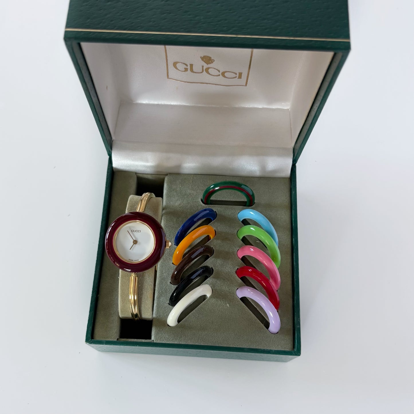 Gucci 1990s Interchangeable Bezel Gold Plated Bangle Watch with 12 bezels, case