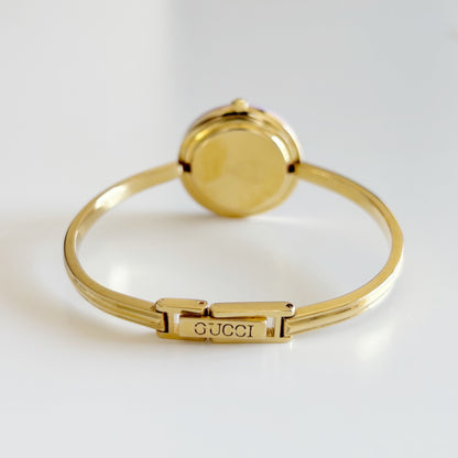 Gucci 1990s Interchangeable Bezel Gold Plated Bangle Watch with 12 bezels, case