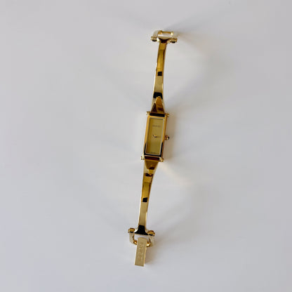 Gucci 1990s Rectangular Gold Dial Gold-Plated Watch