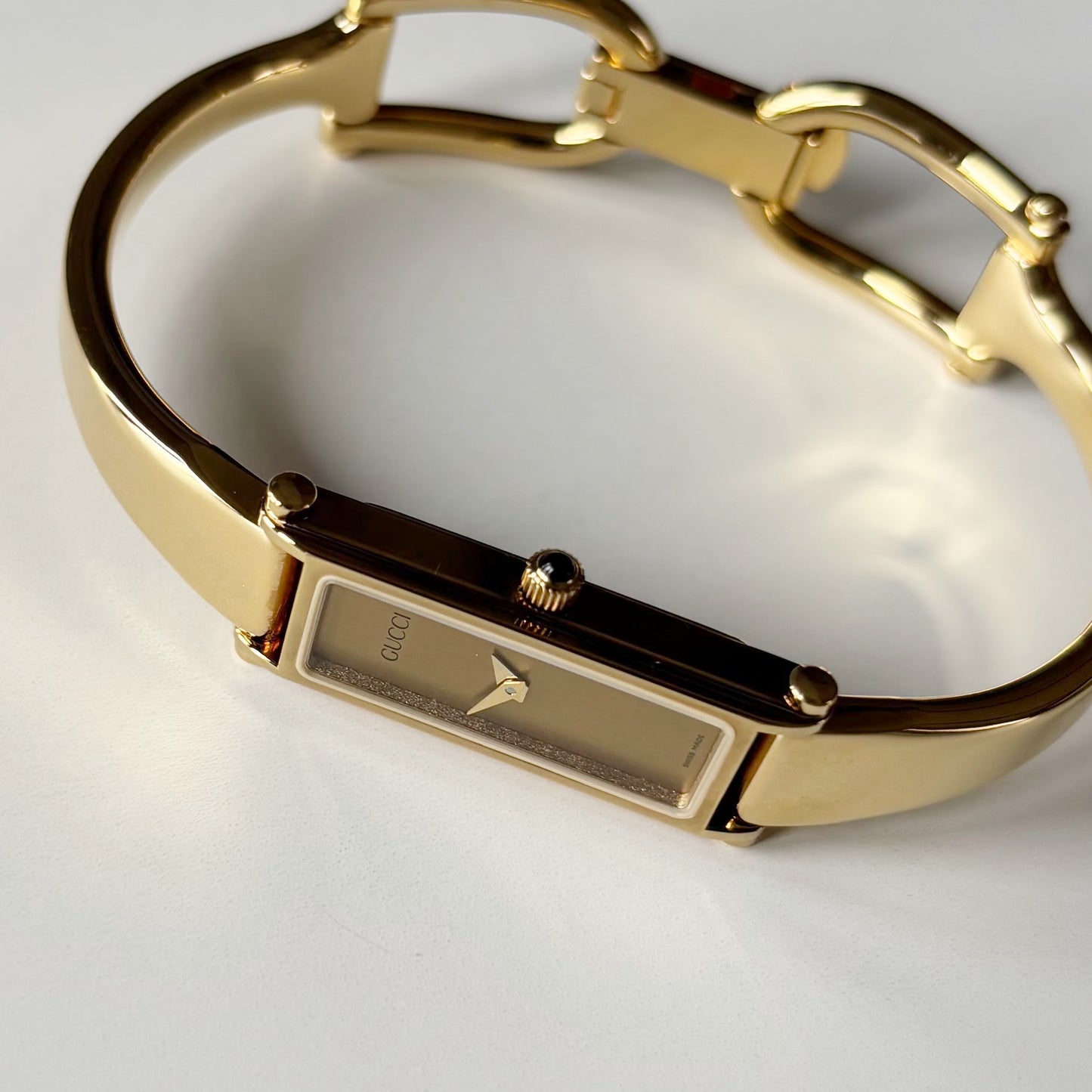 Gucci 1990s Gold Rectangular Dial Gold Plated Bangle Watch