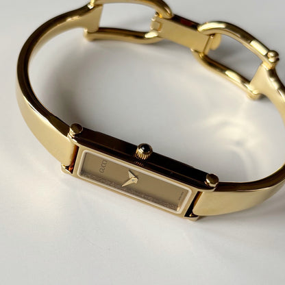 Gucci 1990s Gold Rectangular Dial Gold Plated Bangle Watch