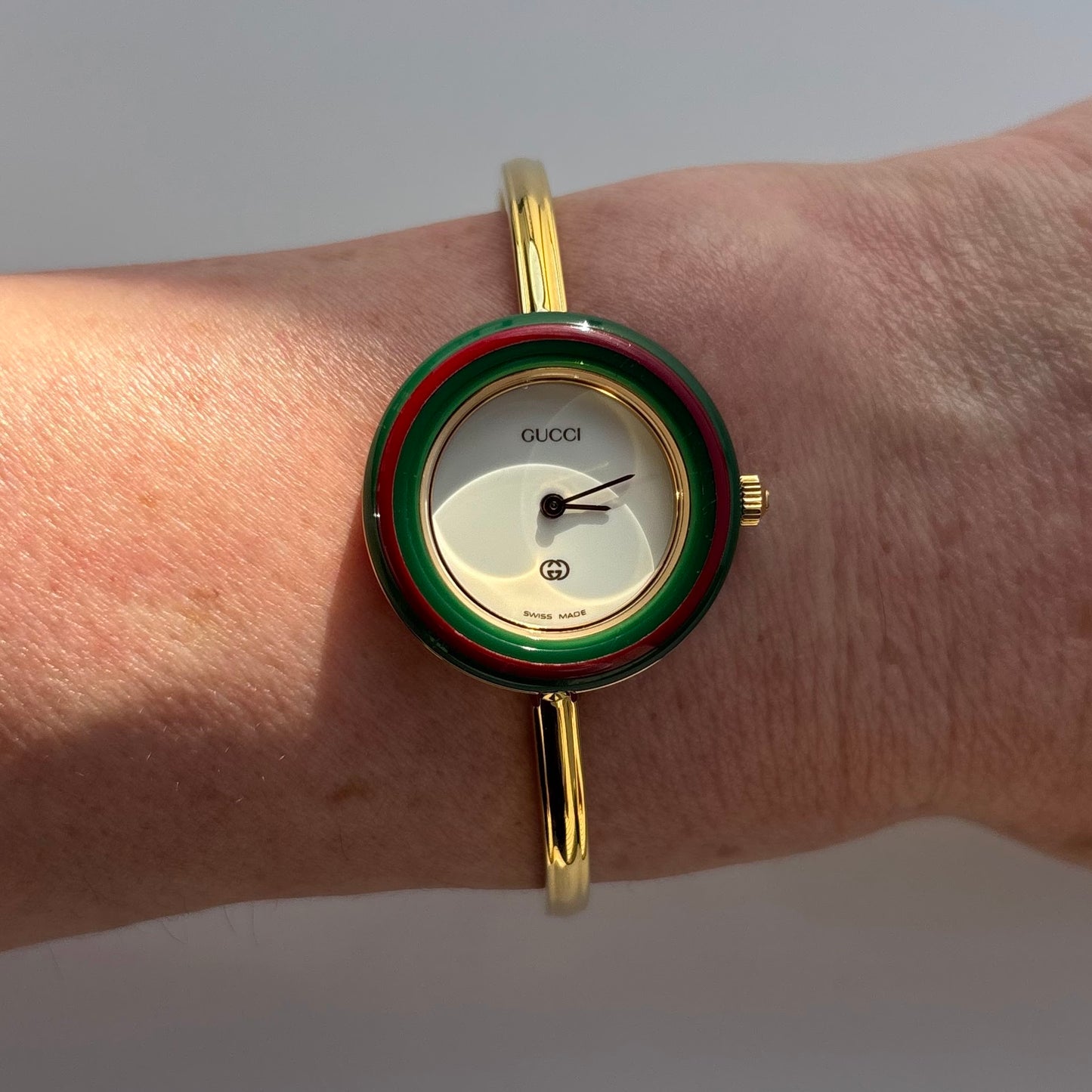 Gucci 1990s Interchangeable Bezel Gold Plated Bangle Watch with 12 bezels, case