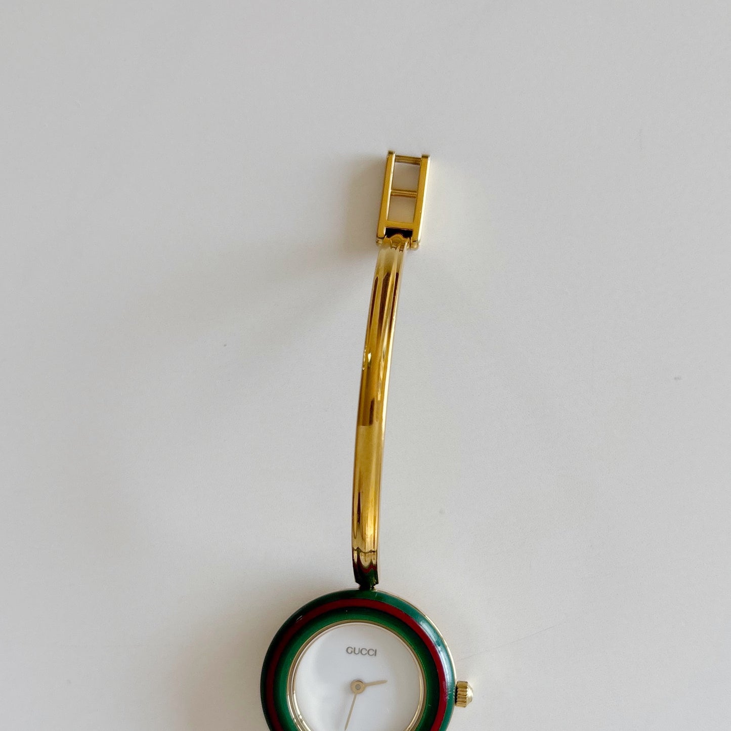 Gucci 1990s Interchangeable Bezel Gold Plated Bangle Watch with 12 bezels, case