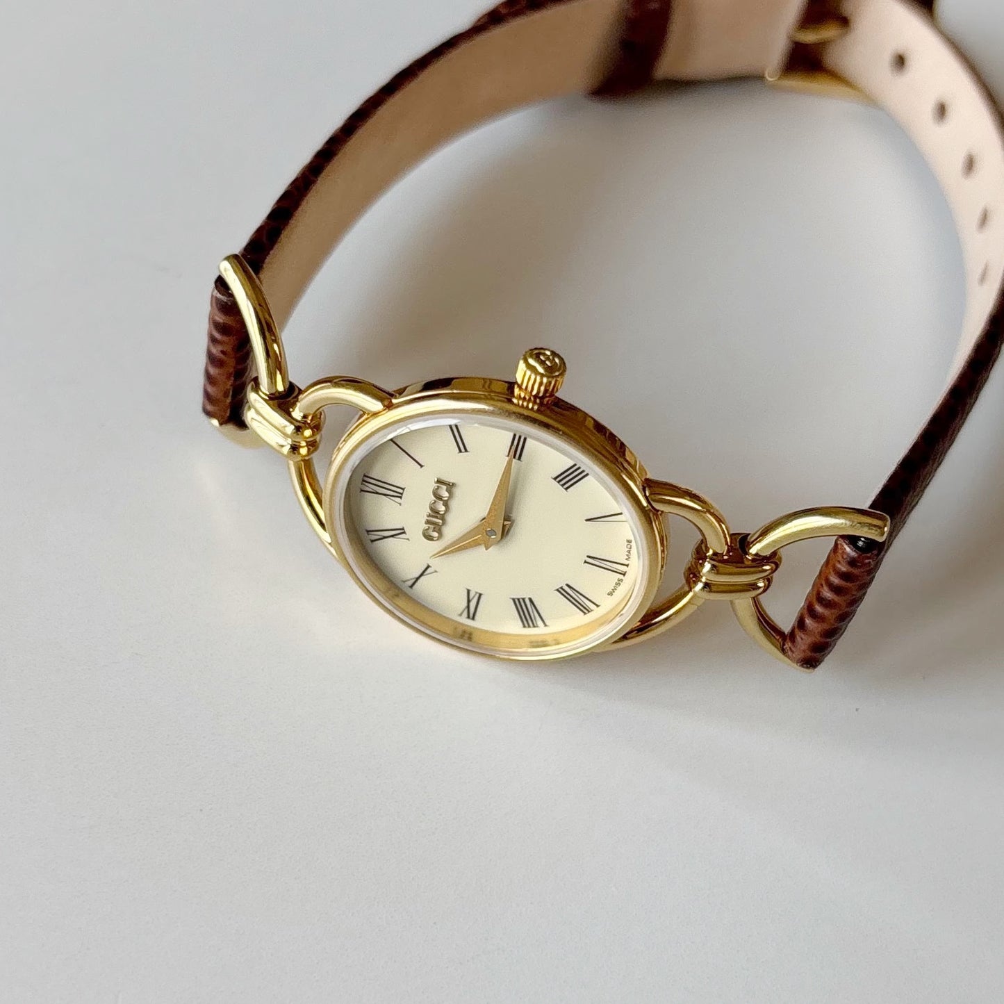 Gucci 1990s Round Cream Dial Horsebit Gold Plated Watch