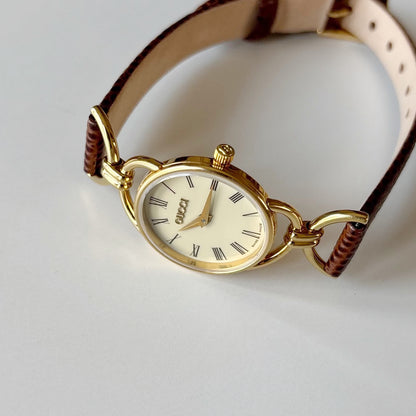 Gucci 1990s Round Cream Dial Horsebit Gold Plated Watch