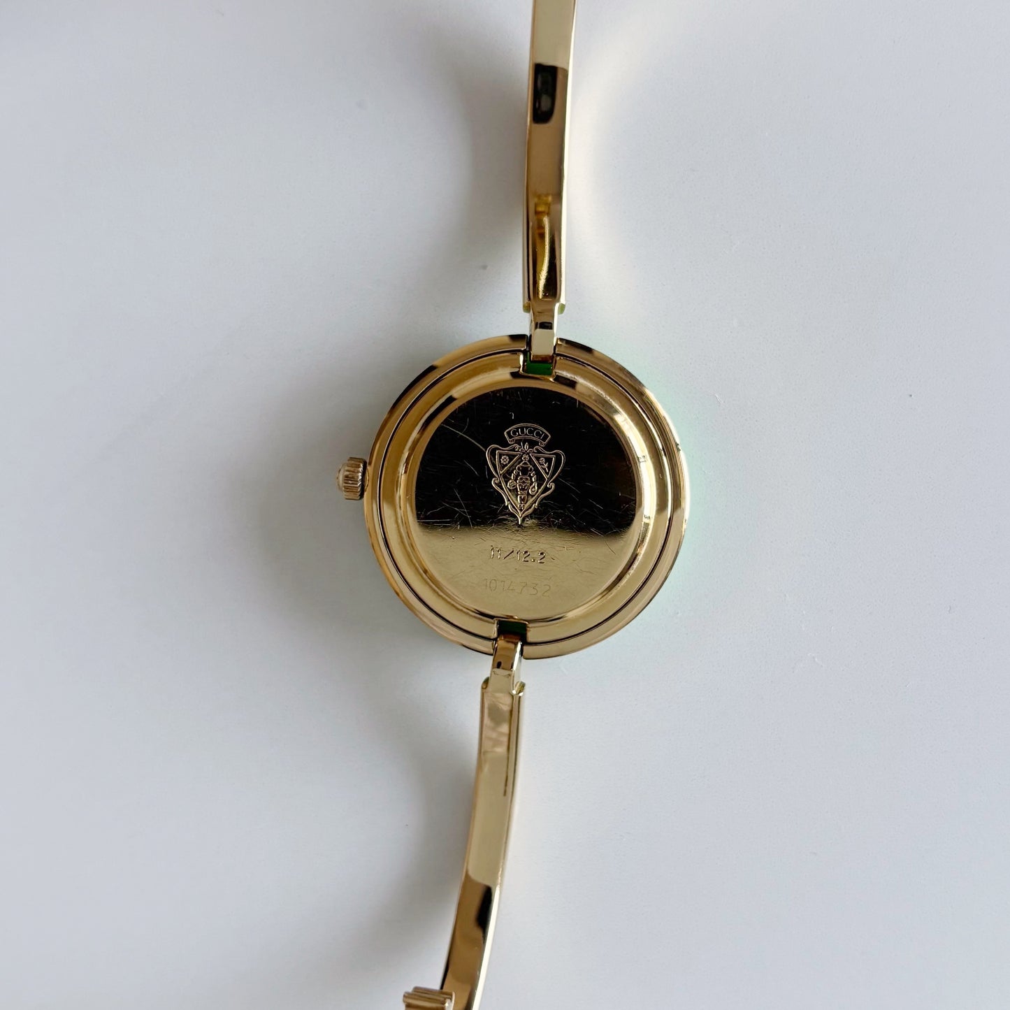 Gucci 1990s Interchangeable Bezel Gold Plated Bangle Watch with 12 bezels, case