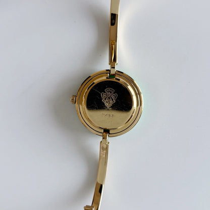 Gucci 1990s Interchangeable Bezel Gold Plated Bangle Watch with 12 bezels, case