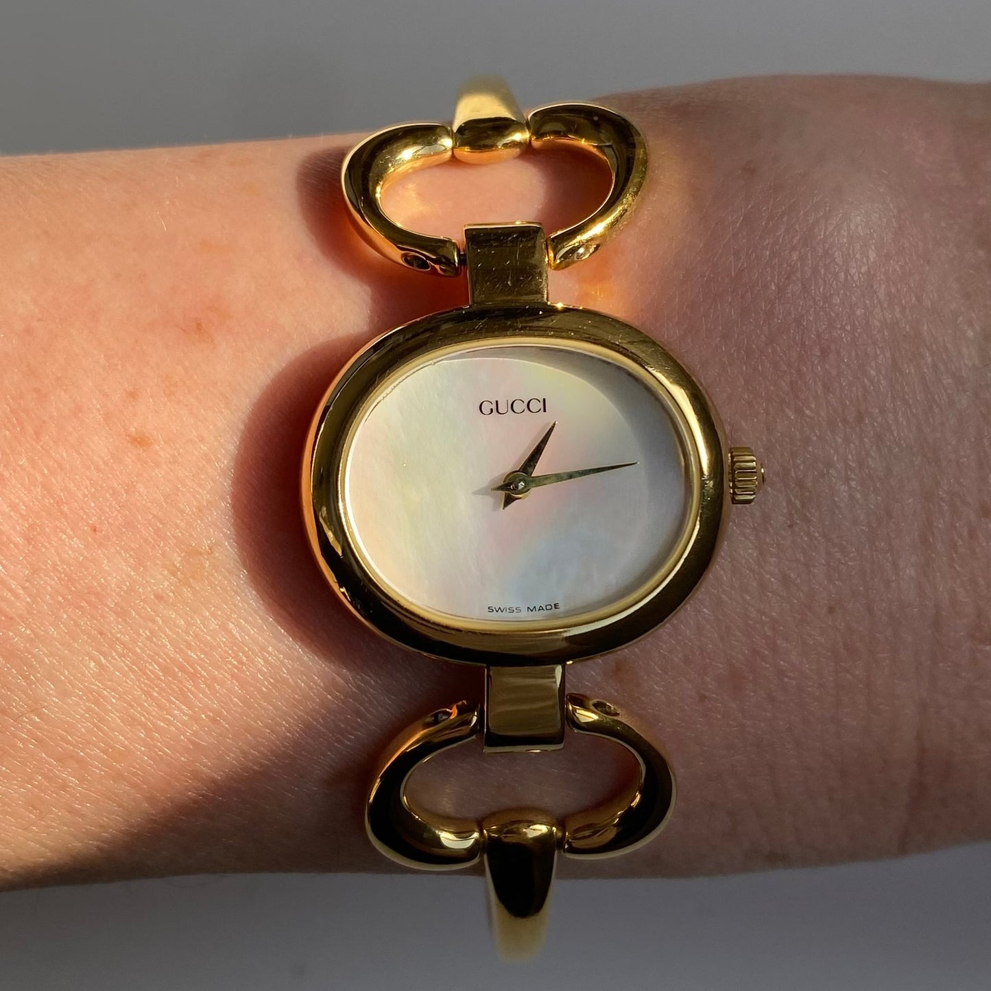 Gucci 1990s Seashell Dial Oval Gold Plated Bangle Watch