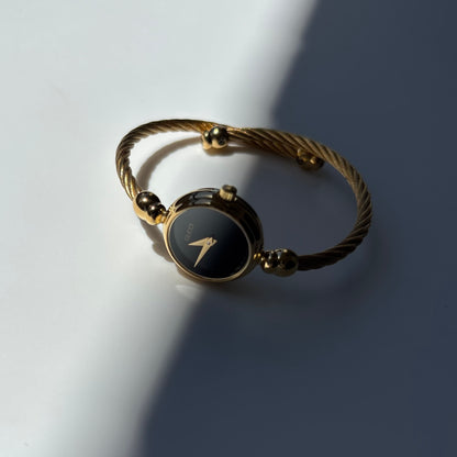 Gucci 1990s Black Round Dial Cable Gold-Plated Bangle Watch