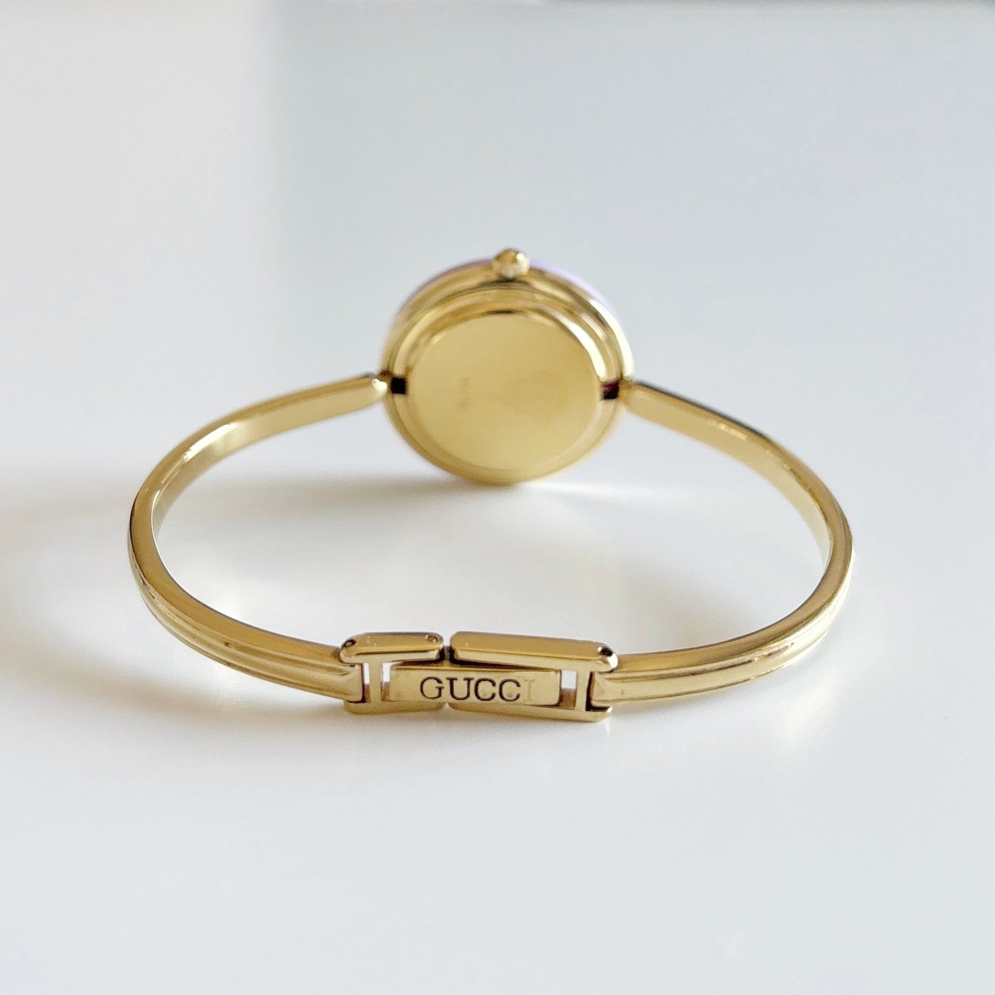 Gucci 1990s Interchangeable Bezel Gold Plated Bangle Watch with 12 bezels, case