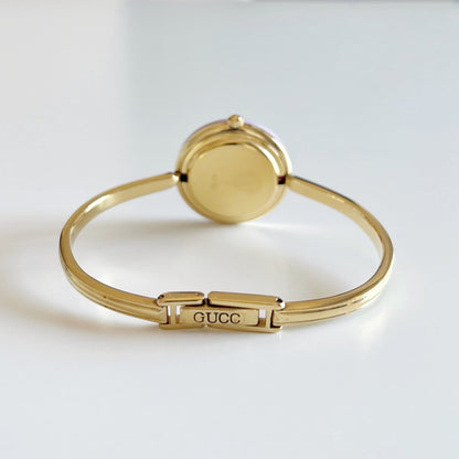 Gucci 1990s Interchangeable Bezel Gold Plated Bangle Watch with 12 bezels, case