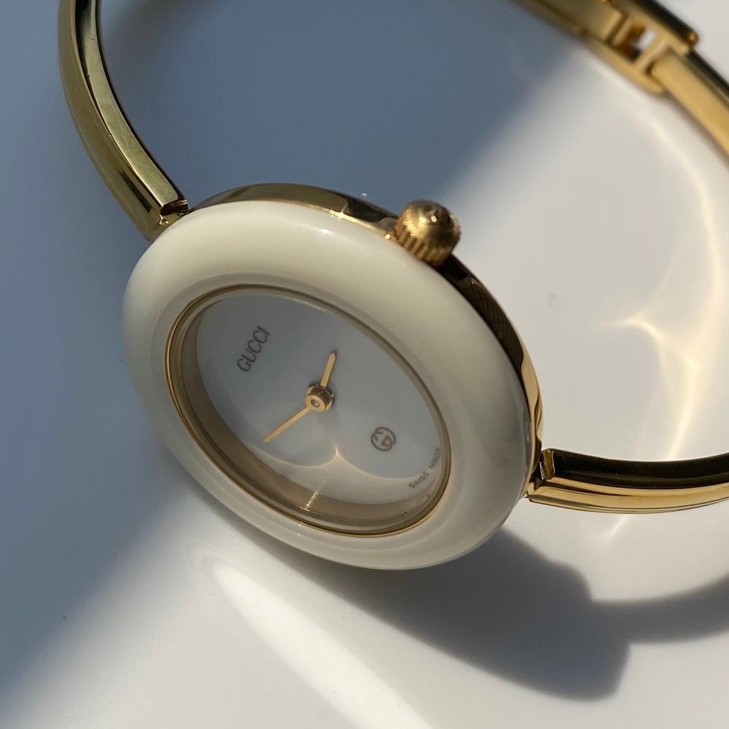 Gucci 1990s Interchangeable Bezel Gold Plated Bangle Watch with 12 bezels, case