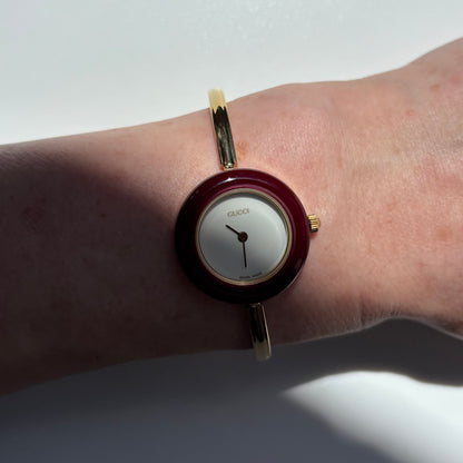 Gucci 1990s Interchangeable Bezel Gold Plated Bangle Watch with 12 bezels, case