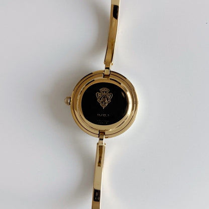 Gucci 1990s Interchangeable Bezel Gold Plated Bangle Watch with 12 bezels, case