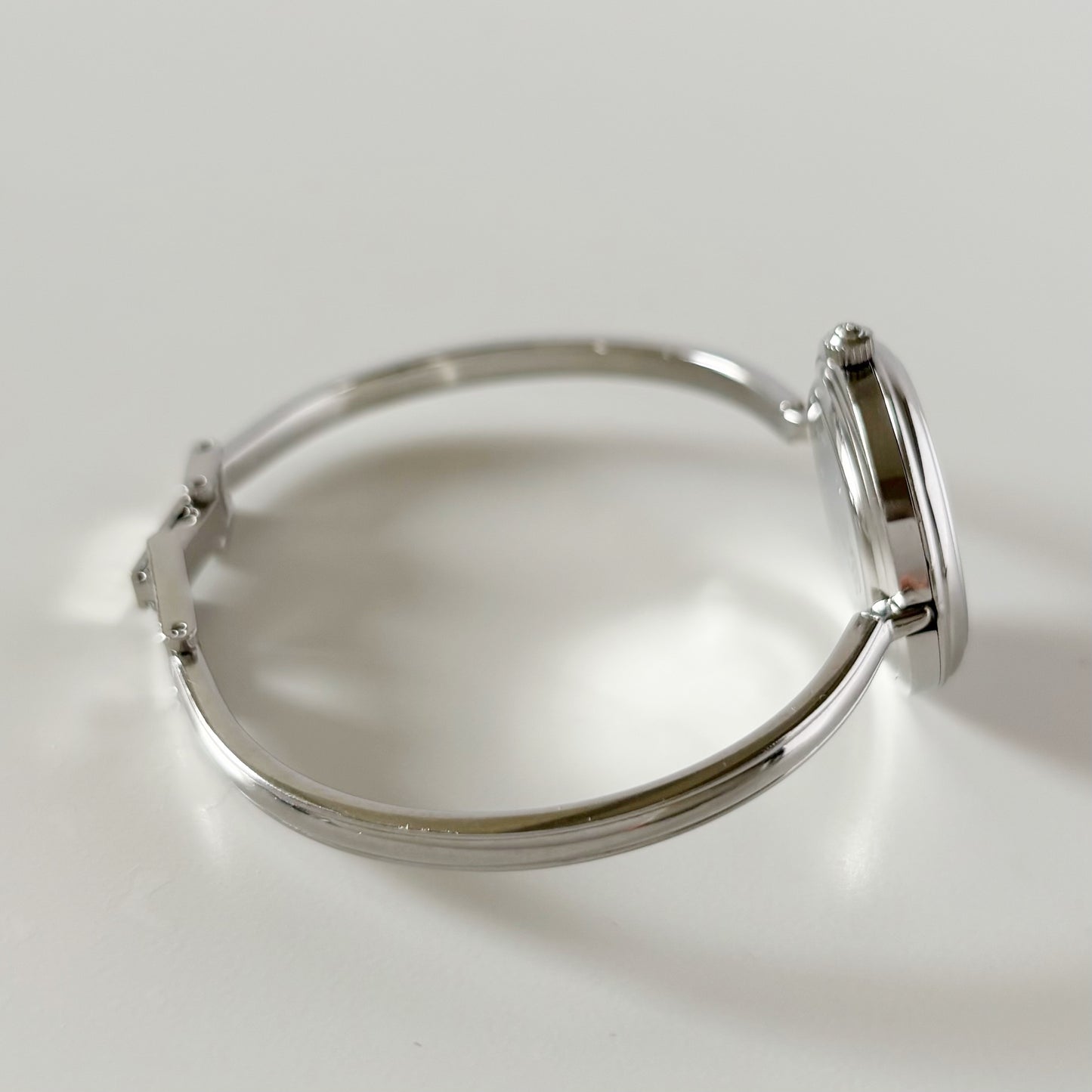 Gucci 1990s Interchangeable Bezel Stainless steel Bangle Watch with 12 bezels, case