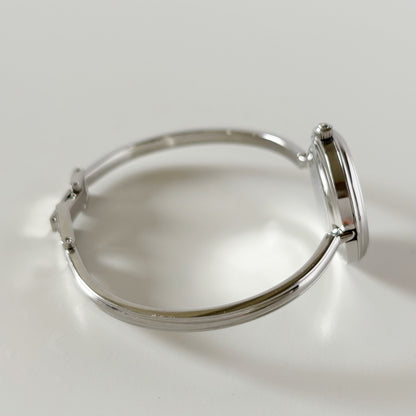 Gucci 1990s Interchangeable Bezel Stainless steel Bangle Watch with 12 bezels, case