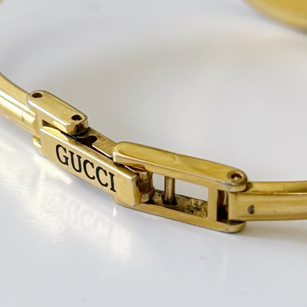 Gucci 1990s Interchangeable Bezel Gold Plated Bangle Watch with 12 bezels, case (Small)