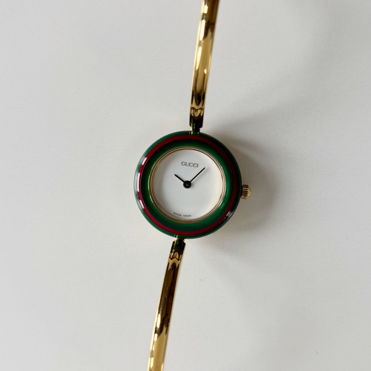 Gucci 1990s Interchangeable Bezel Gold Plated Bangle Watch with 12 bezels, case