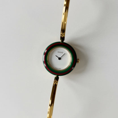 Gucci 1990s Interchangeable Bezel Gold Plated Bangle Watch with 12 bezels, case