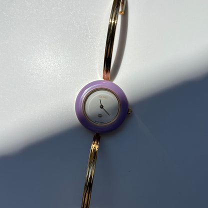 Gucci 1990s Interchangeable Bezel Gold Plated Bangle Watch with 12 bezels, case