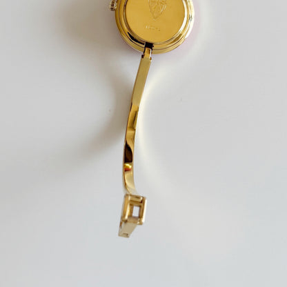 Gucci 1990s Interchangeable Bezel Gold Plated Bangle Watch with 12 bezels, case