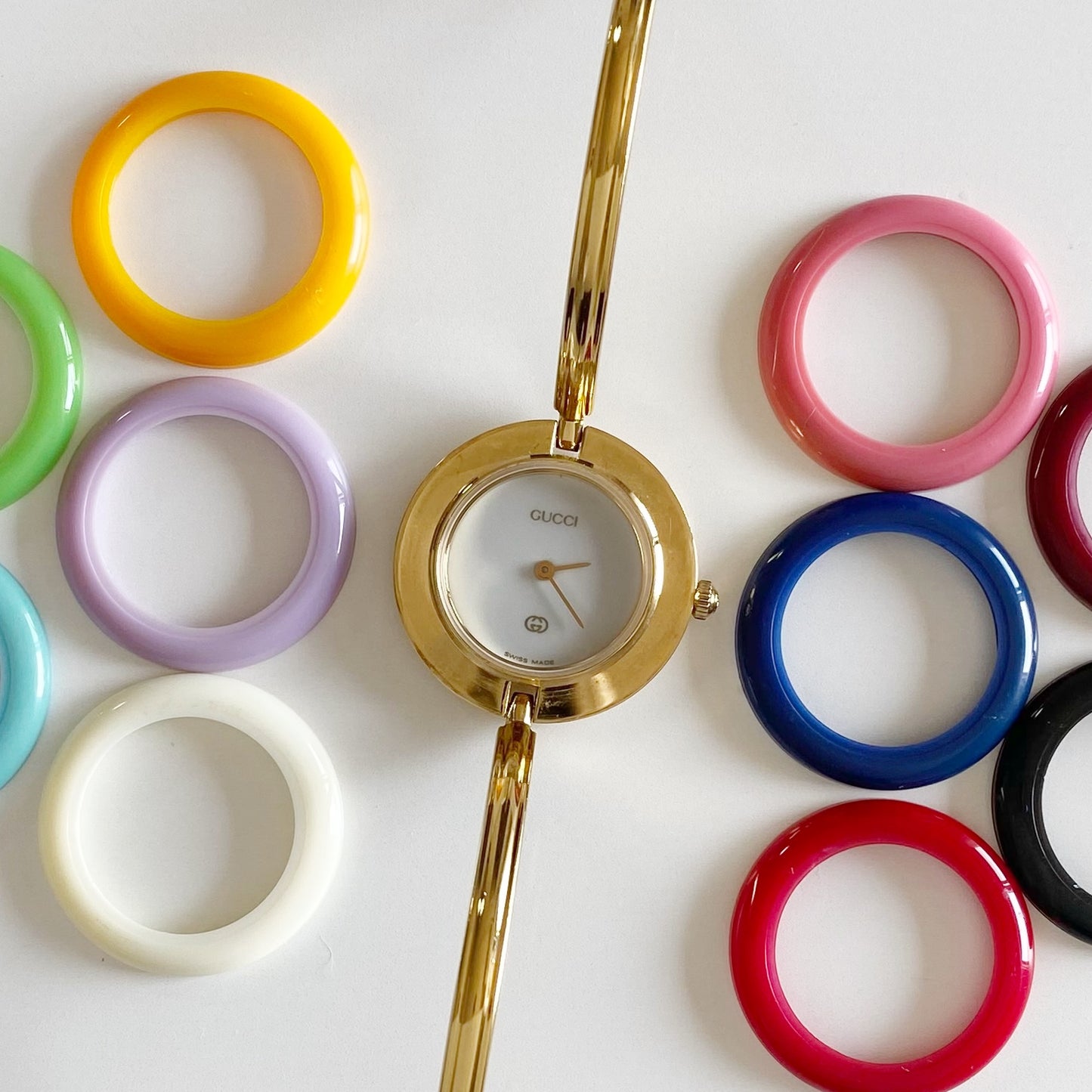 Gucci 1990s Interchangeable Bezel Gold Plated Bangle Watch with 12 bezels, case