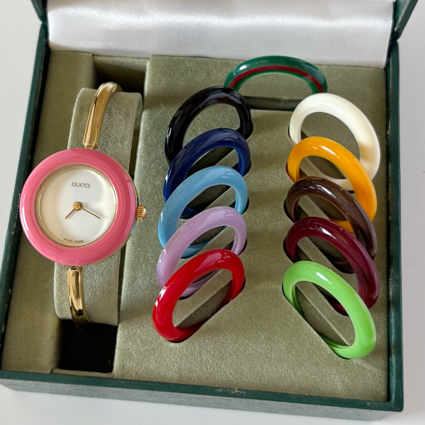 Gucci 1990s Interchangeable Bezel Gold Plated Bangle Watch with case, 12 bezels
