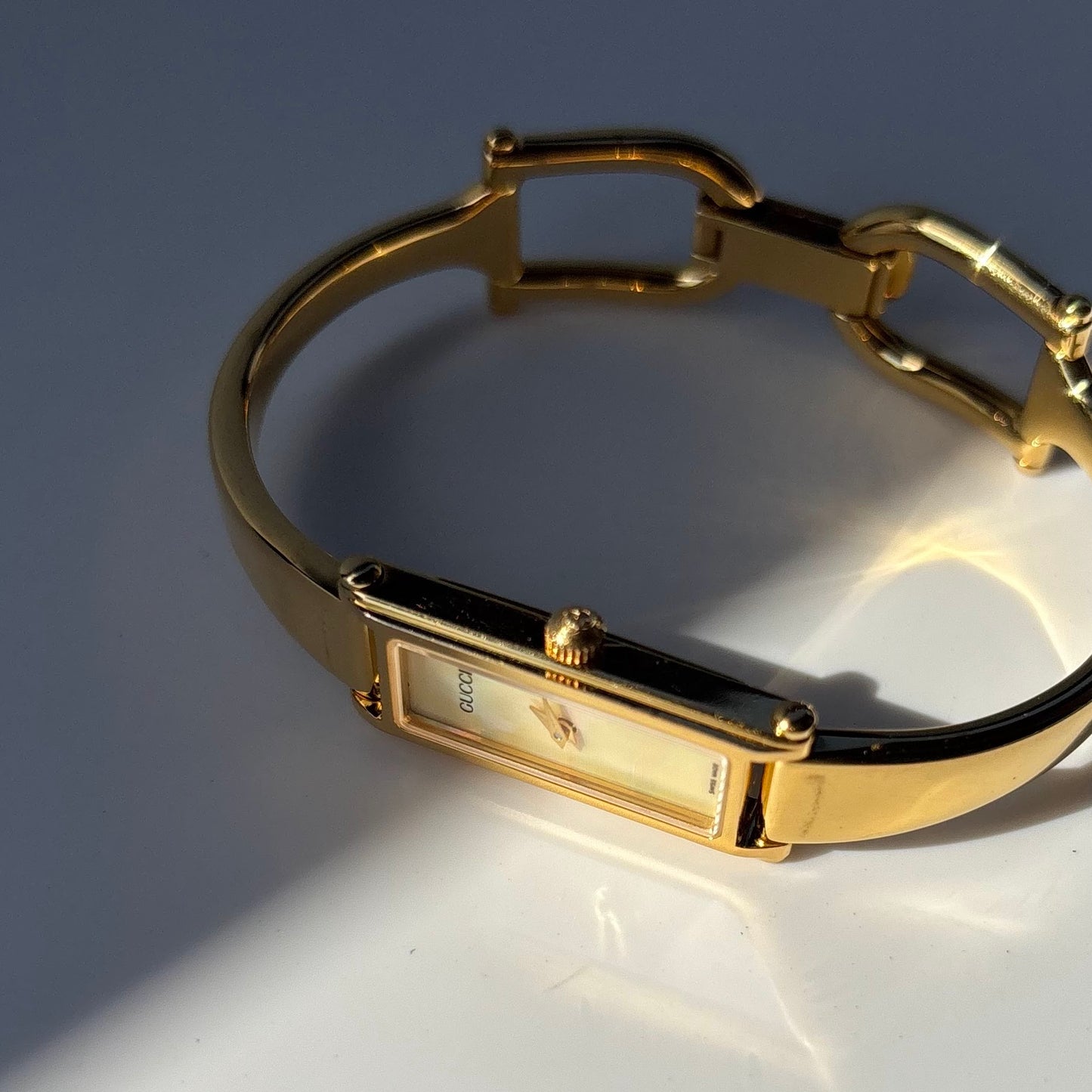 Gucci 1990s Rectangular Seashell Dial Gold Plated Bangle Watch