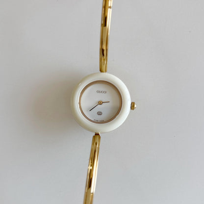 Gucci 1980s Interchangeable Bezel Gold Plated Bangle Watch with 12 bezels, case
