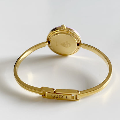 Gucci 1990s Interchangeable Bezel Gold Plated Bangle Watch with 12 bezels, case