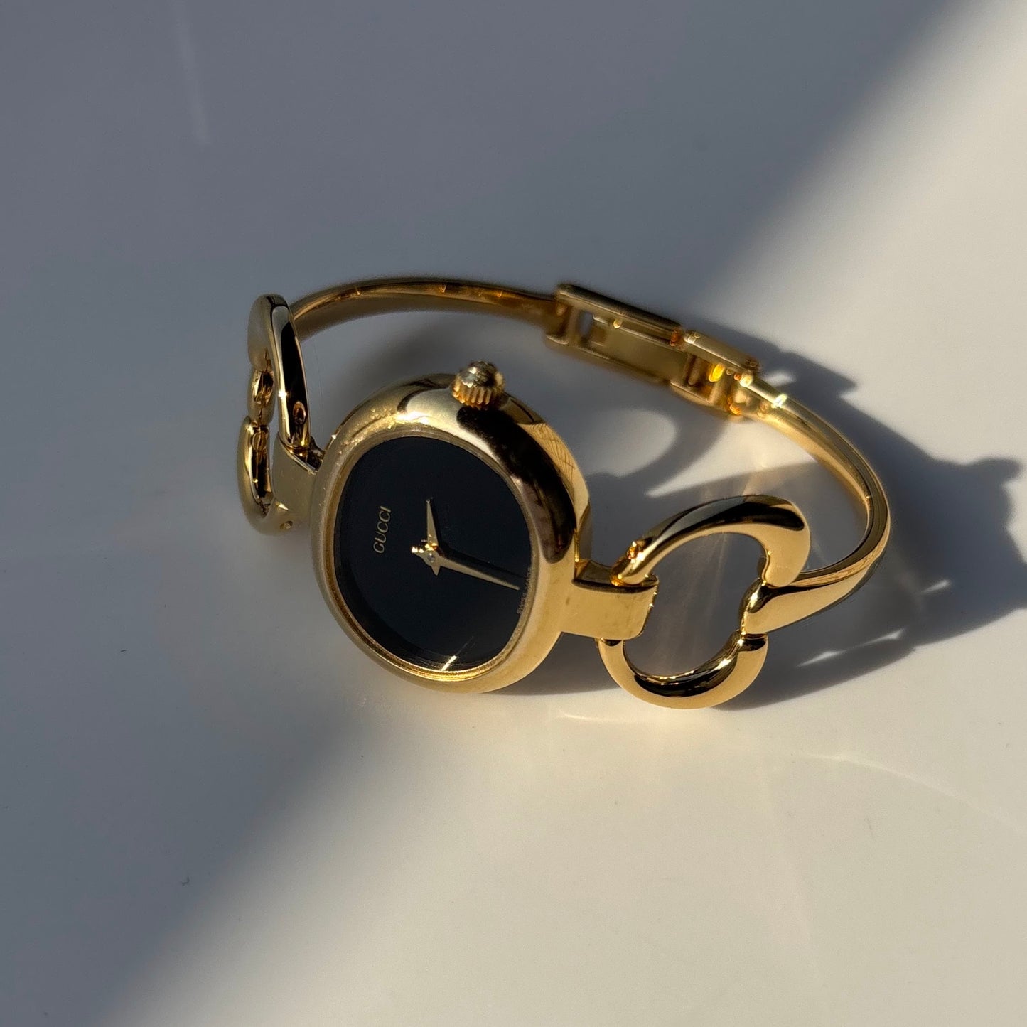 Gucci 1990s Oval Black Dial Gold Plated Bangle Watch (Small)