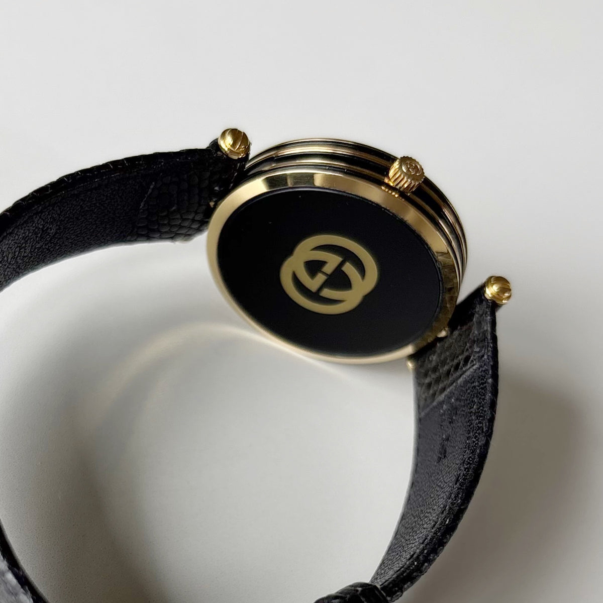 Gucci 1980s Round Black Dial Gold-Plated Watch (Large)