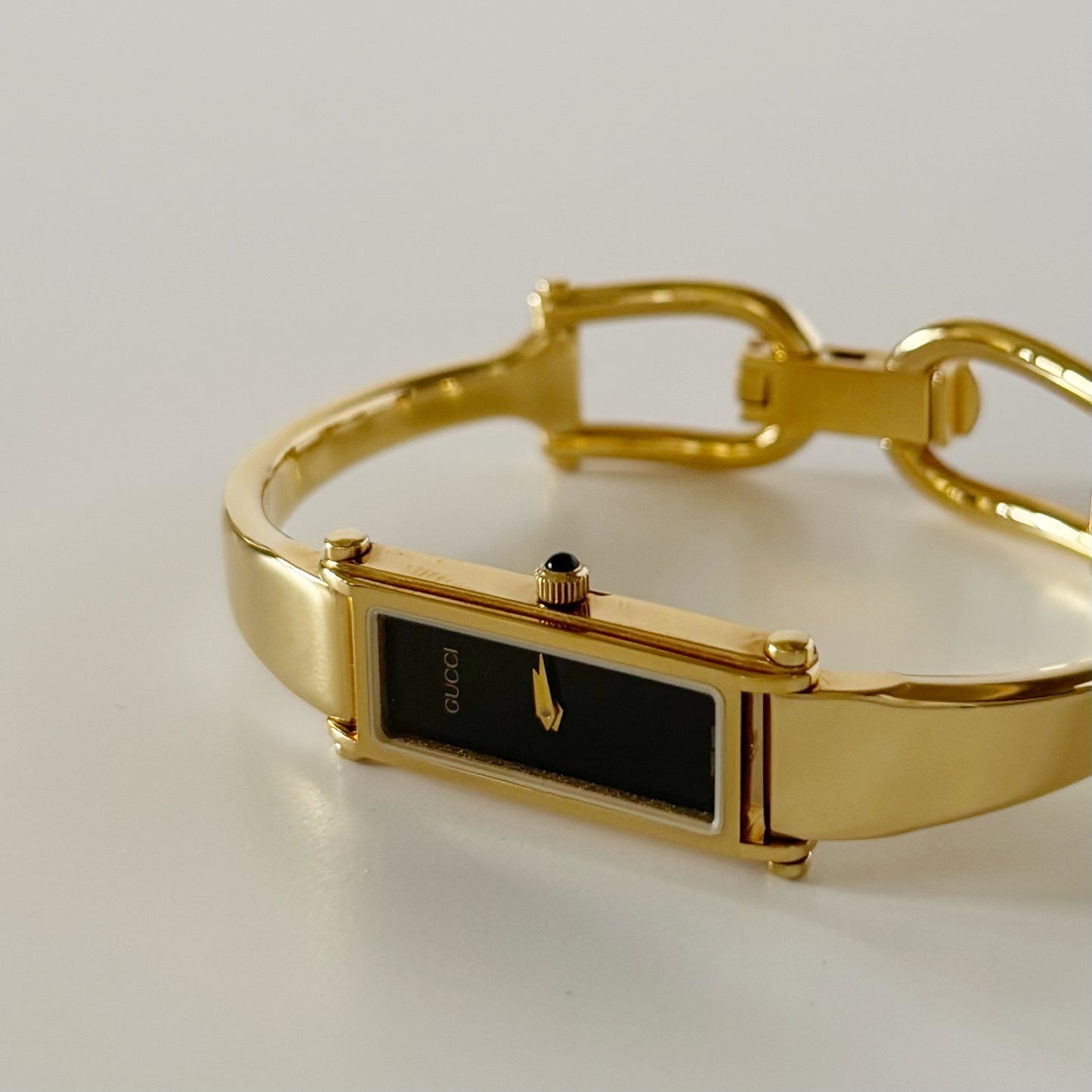 Gucci 1990s Rectangular Black Dial Gold Plated Bangle Watch