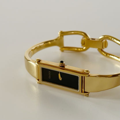 Gucci 1990s Rectangular Black Dial Gold Plated Bangle Watch