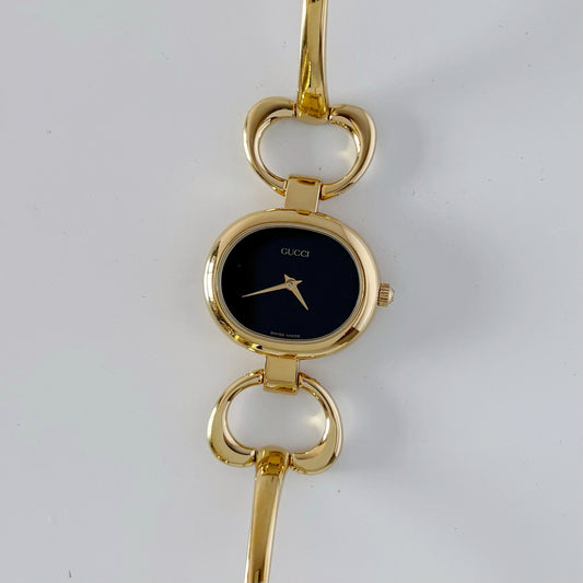 Gucci 1990s Black Dial Gold Plated Bangle Watch