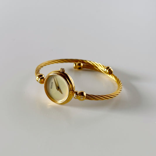 Gucci 1990s Seashell Dial Gold Plated Cable Bangle Watch