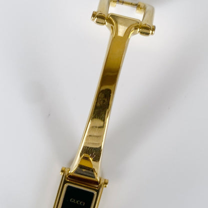 Gucci 1990s Black Dial Rectangular Gold Plated Bangle Watch