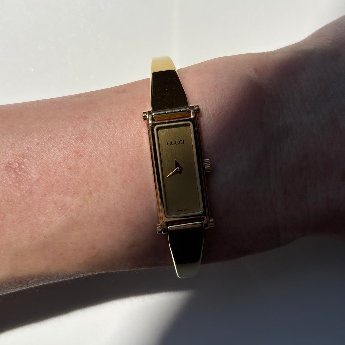 Gucci 1990s Gold Rectangular Dial Gold Plated Bangle Watch
