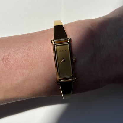 Gucci 1990s Gold Rectangular Dial Gold Plated Bangle Watch